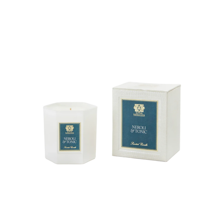 White candle with 'Antica farmacista Neroli & Tonic' label next to its packaging 