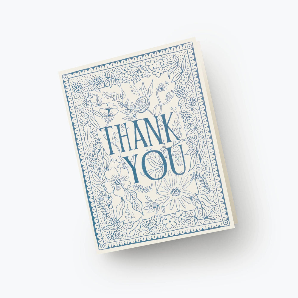 Card with 'Thank You' text and blue floral design