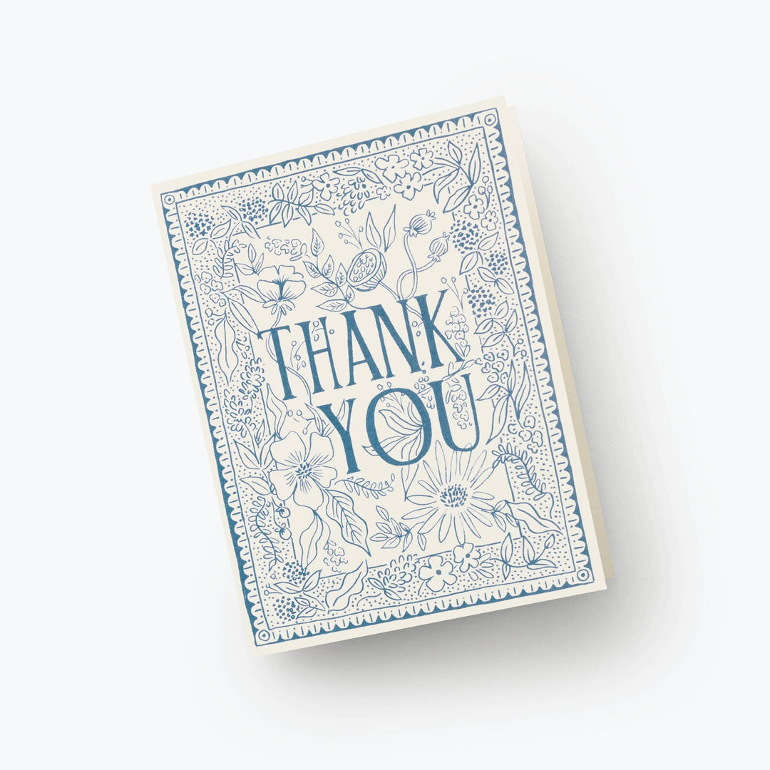 Card with 'Thank You' text and blue floral design