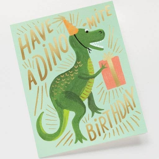 Birthday card with a green dinosaur holding a gift and text on light green paper