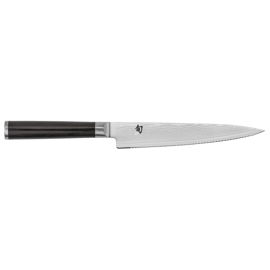 Serrated Shun knife with black handle on a white background