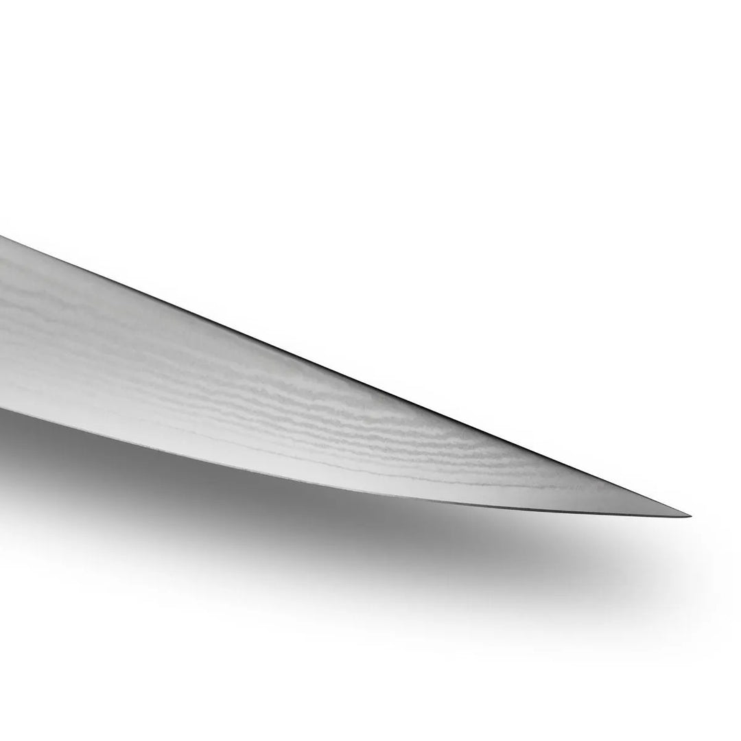 Close-up of a metallic blade on a white background