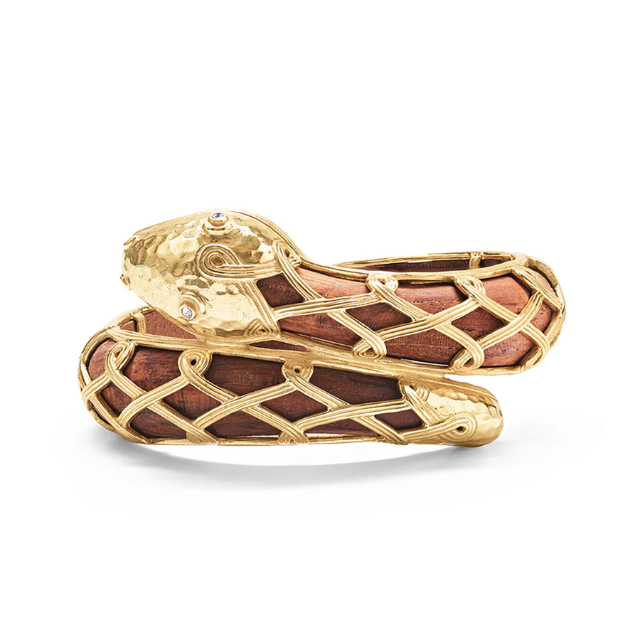 Gold and wood snake-shaped jewelry piece 