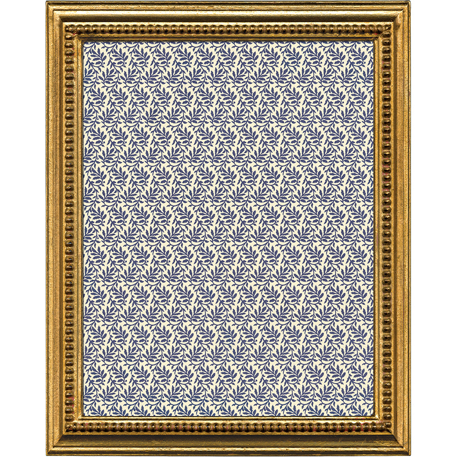 an ornate gold frame.