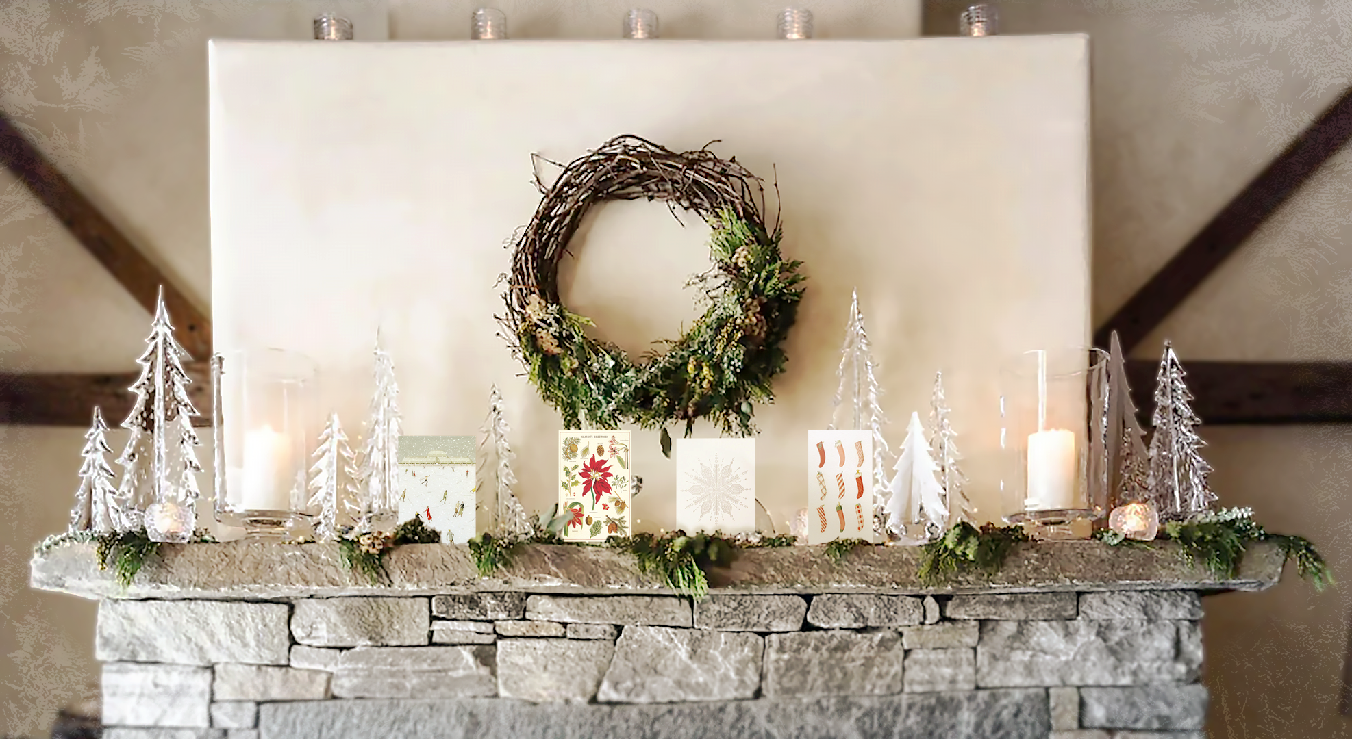 A christmas mantle with simon pearce trees and christmas greeting cards by cavallini and hester and cook