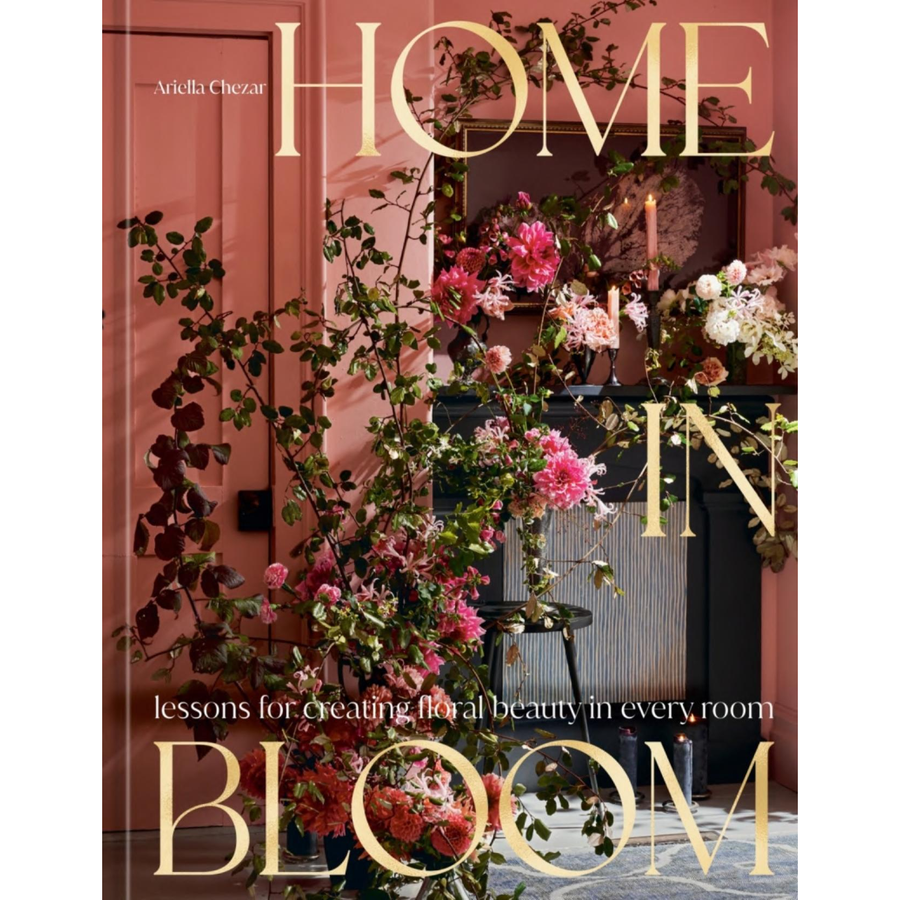 Book cover of 'Home in Bloom' with floral decorations and a color washed pink room