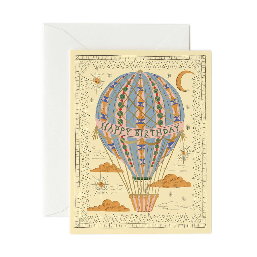 Greeting card with hot air balloon design and 'Happy Birthday' text on beige paper.