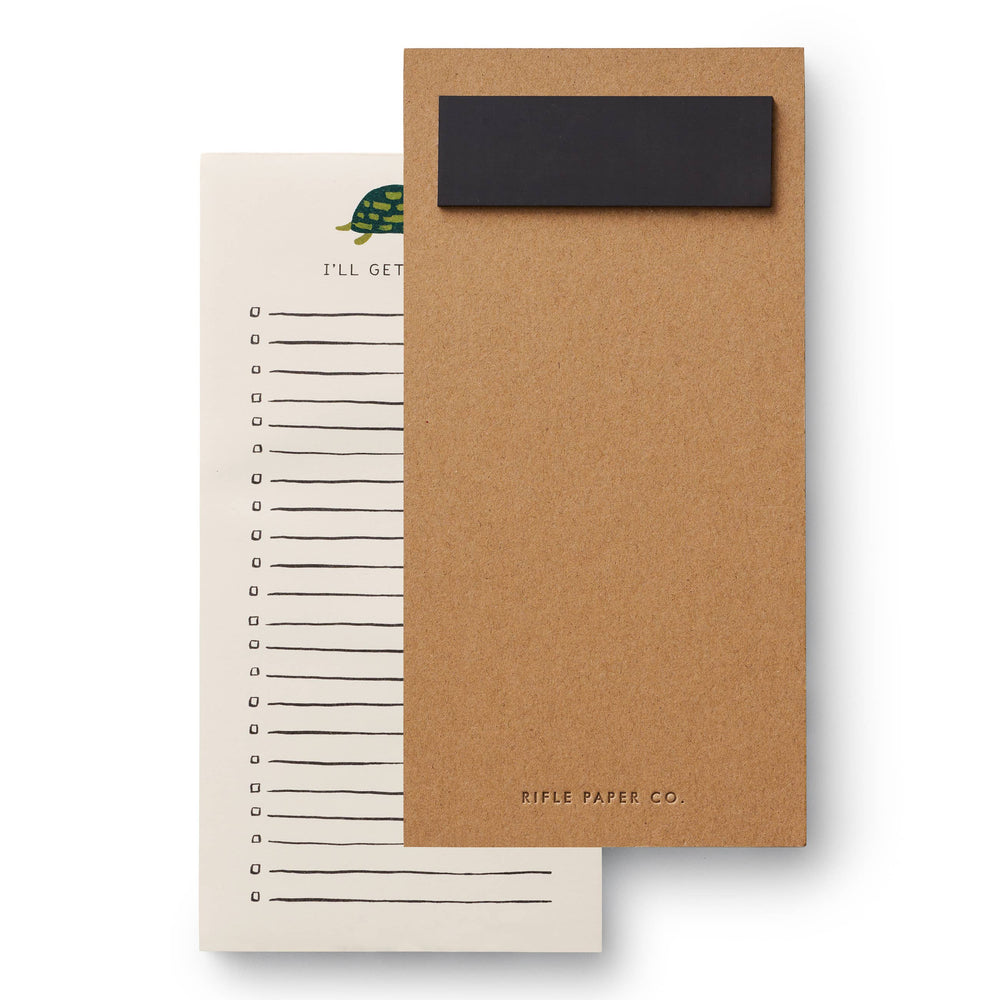 the cardboard backside of a reminder pad with a turtle illustration reading "i'll get to it" showing a magnet 
