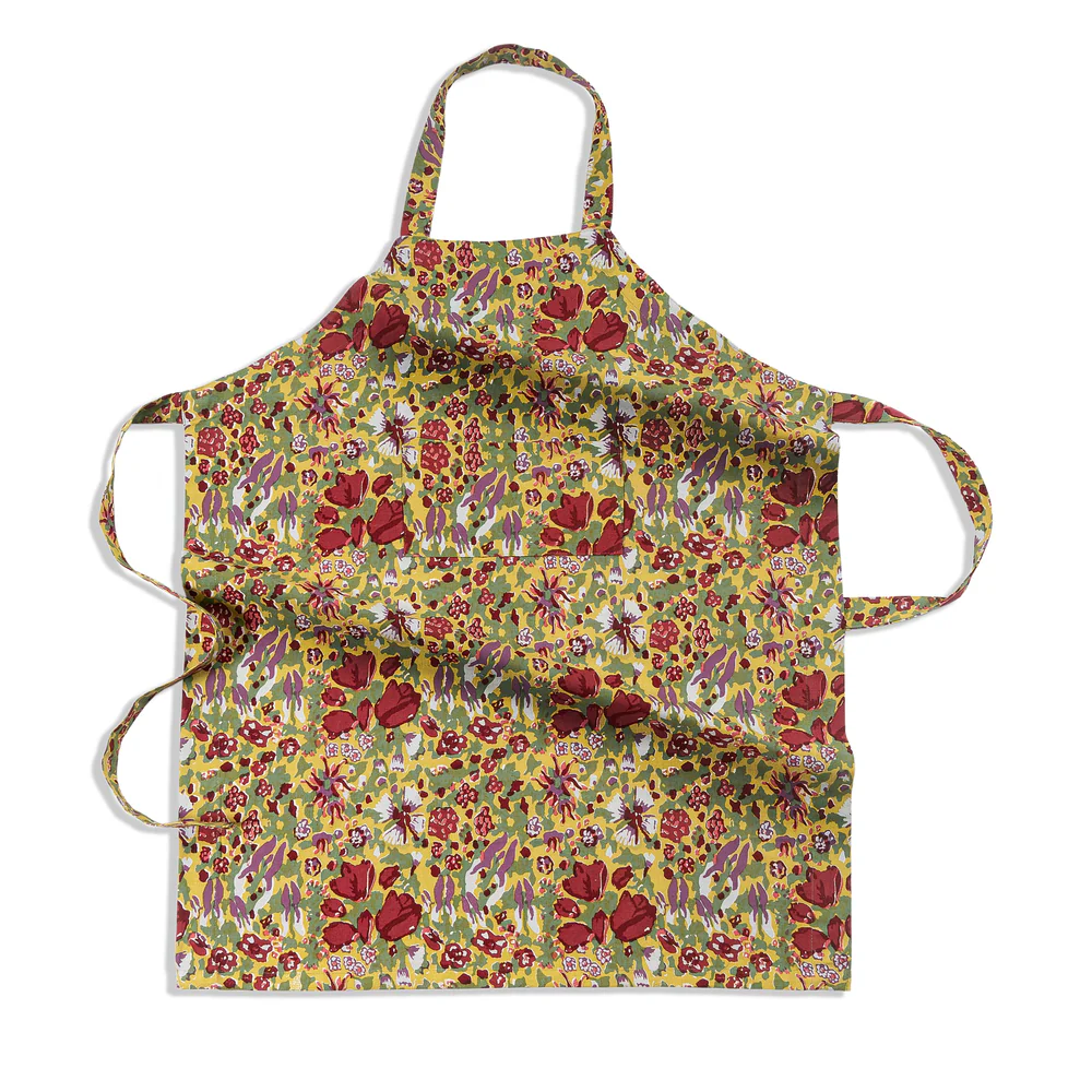 Floral apron with a green and red colorful pattern on a white background