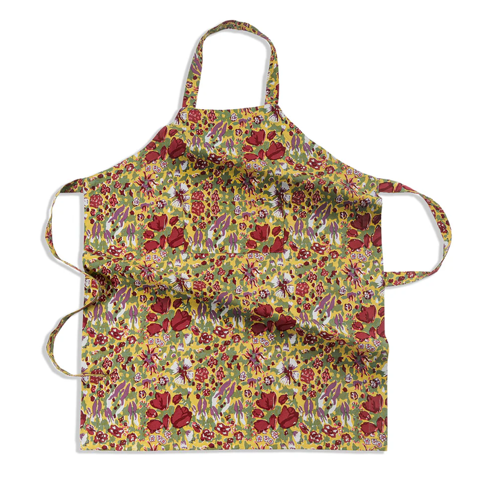 Floral apron with a green and red colorful pattern on a white background