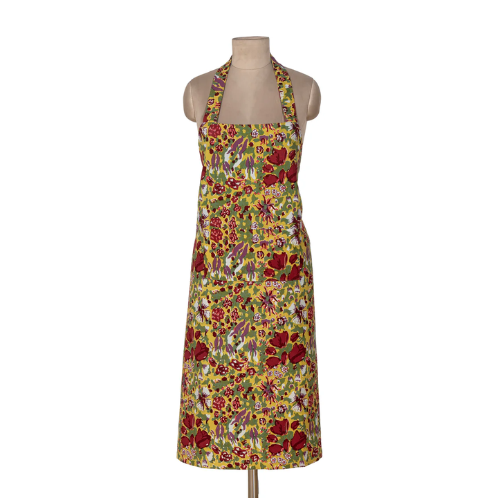 Floral apron on a mannequin against a white background