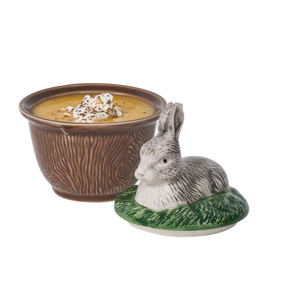 Ceramic bowl with a wood design and a rabbit-shaped lid on a white background