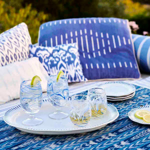 Juliska Puro Marbled Blue Goblet on a tray with stemless white wine glasses