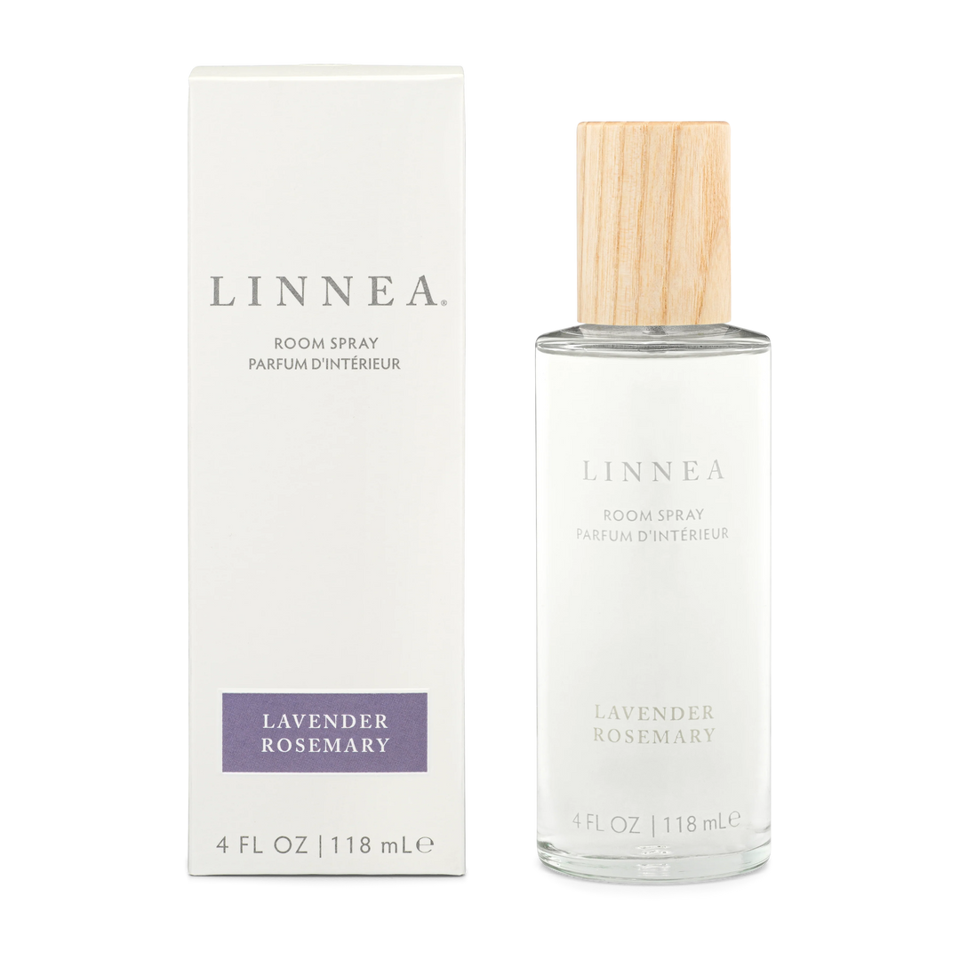 A lavender rosemary roomspray by linnea with its box next to it