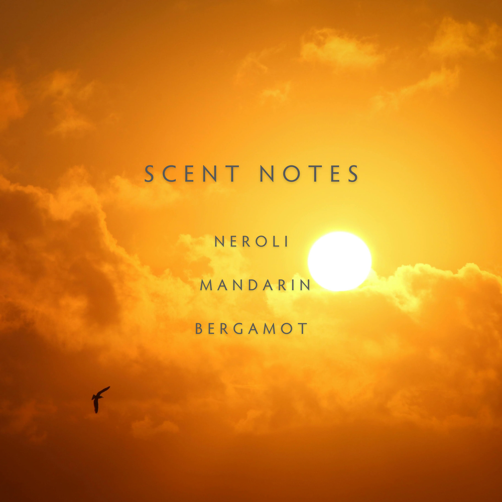 Sunset with clouds and text 'SCENT NOTES NEROLI MANDARIN BERGAMOT' 