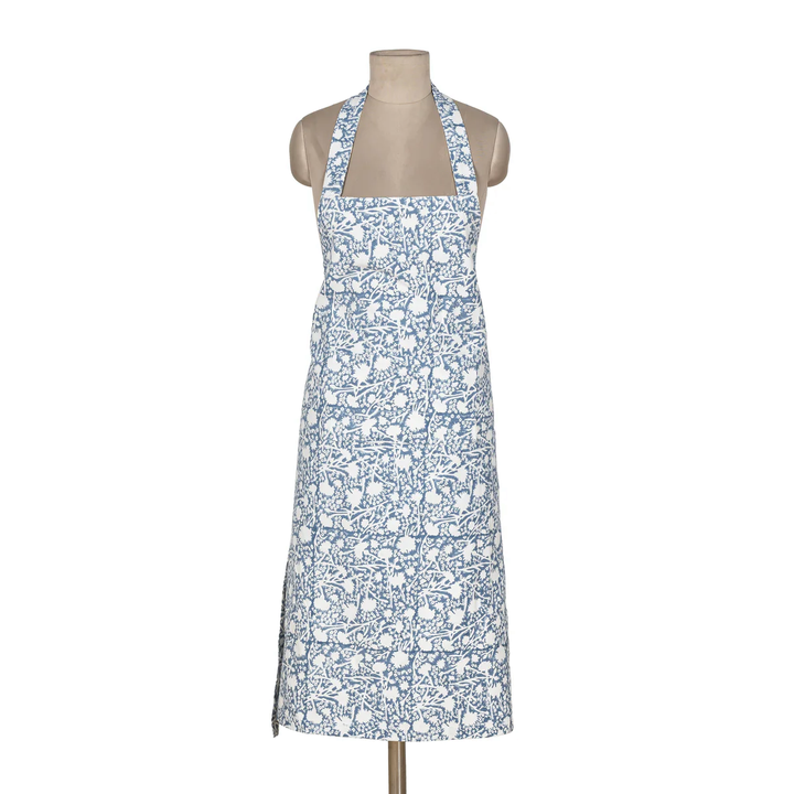 Floral apron on a mannequin against a white background