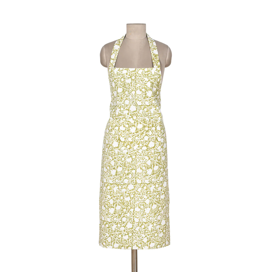 Green and white floral dress on a mannequin against a white background