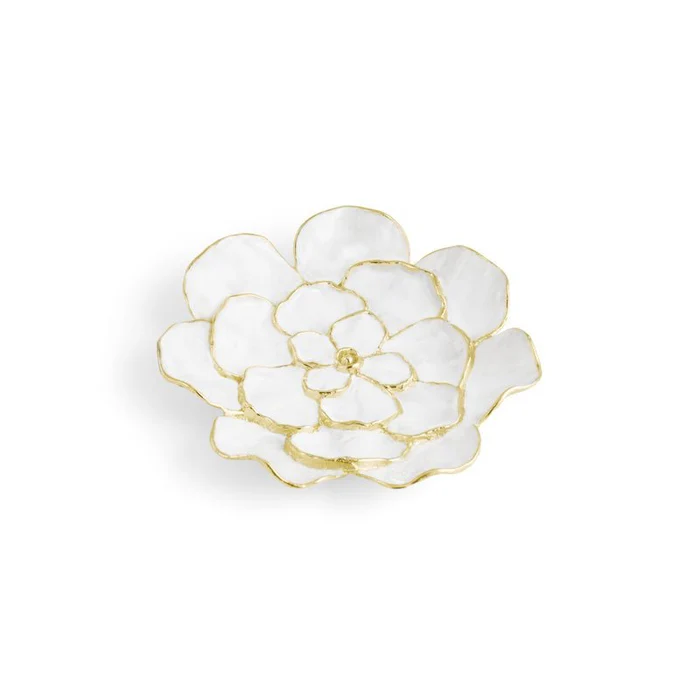 White flower-shaped dish with gold trim on a white background