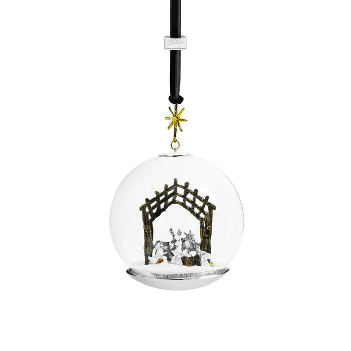 Snowglobe christmas ornament with a nativity creche inside