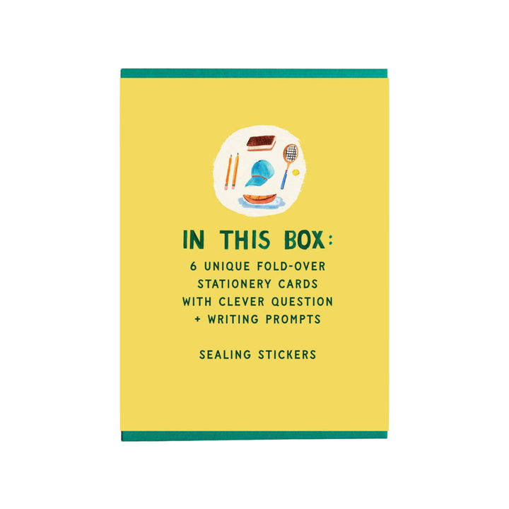 Yellow box with stationery items and text 