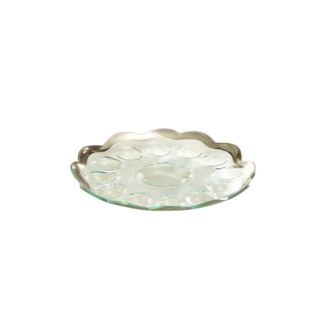 A glass devilled egg dish with a platnum rim
