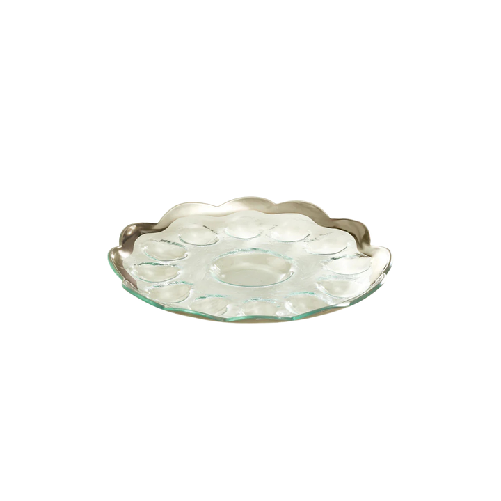 A glass devilled egg dish with a platnum rim