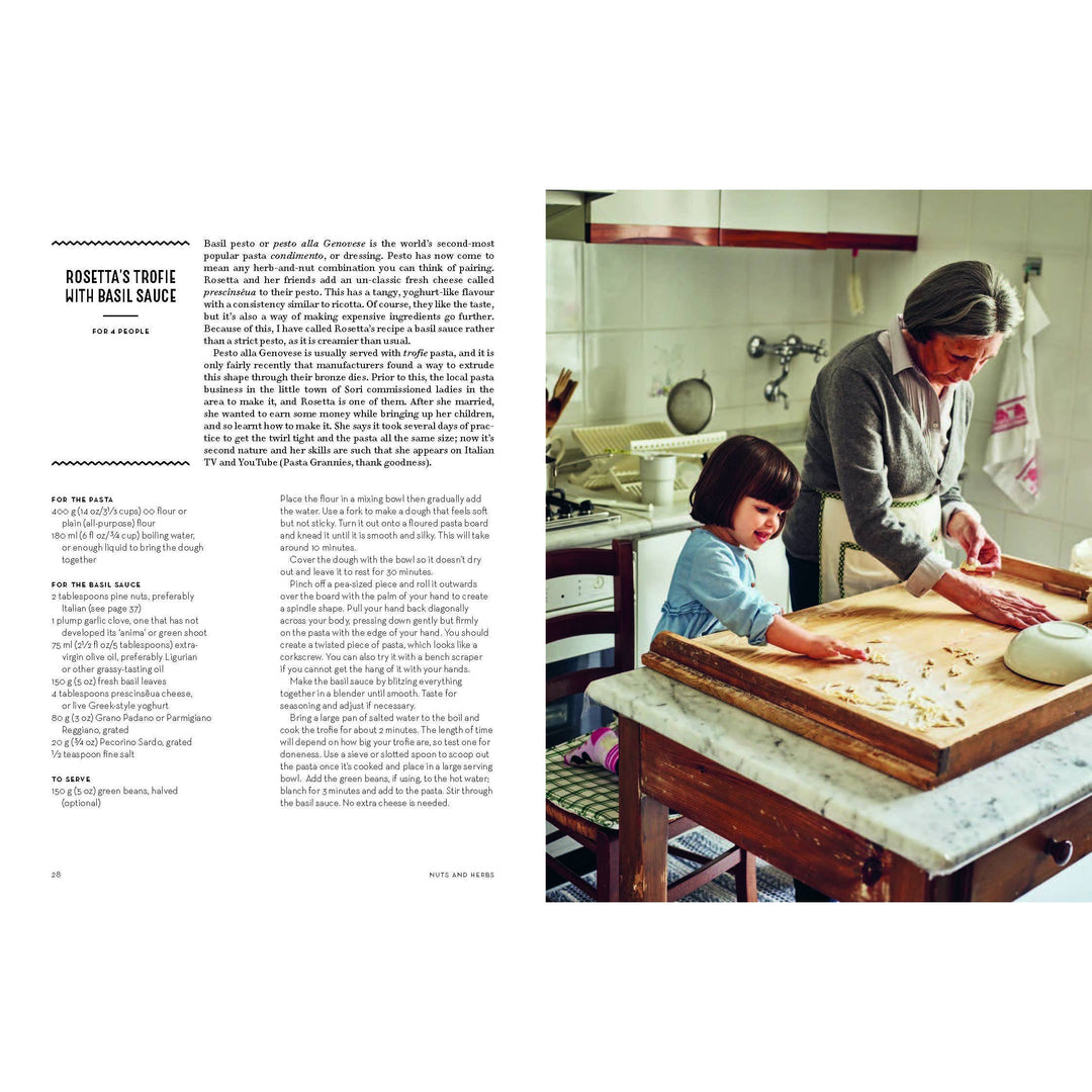 Woman and child in a kitchen preparing food together.