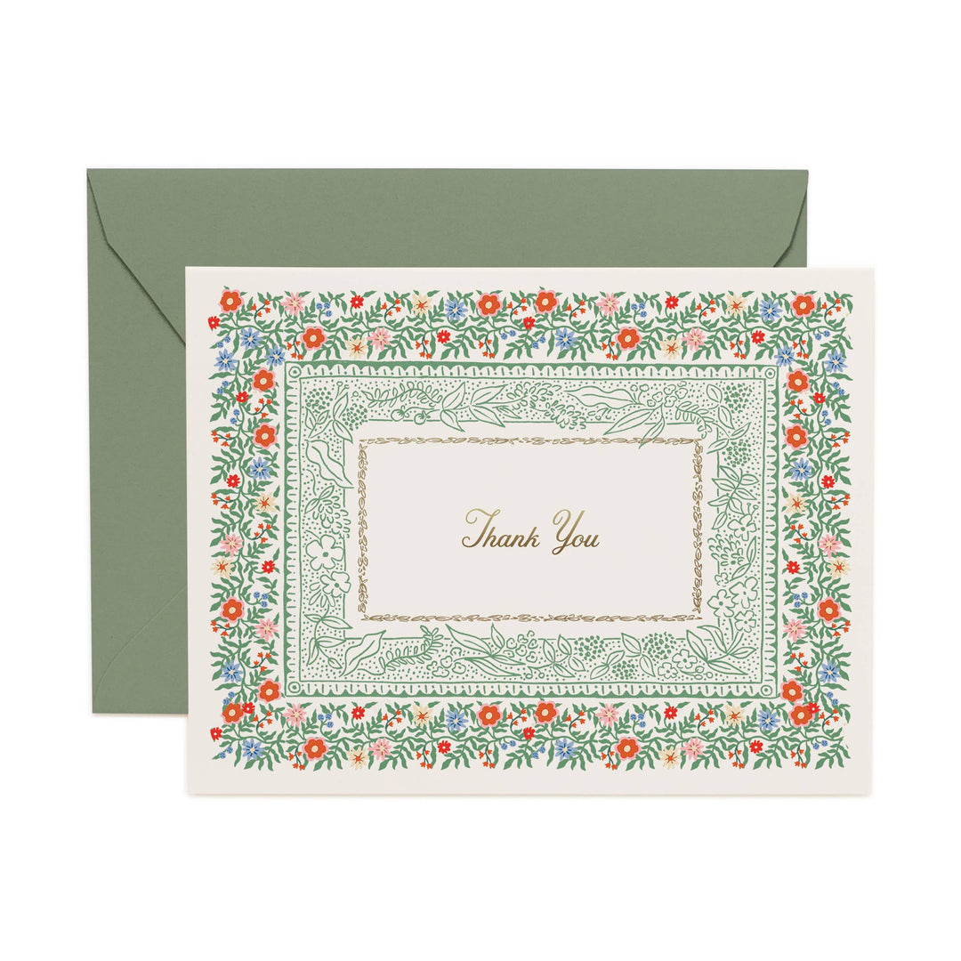 Floral border card with 'Thank You' text and matching green envelope on a white background