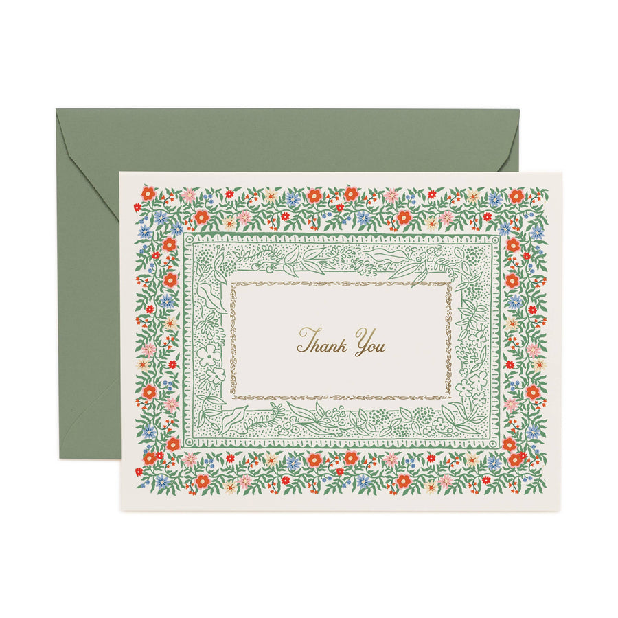 Floral border card with 'Thank You' text and matching green envelope on a white background