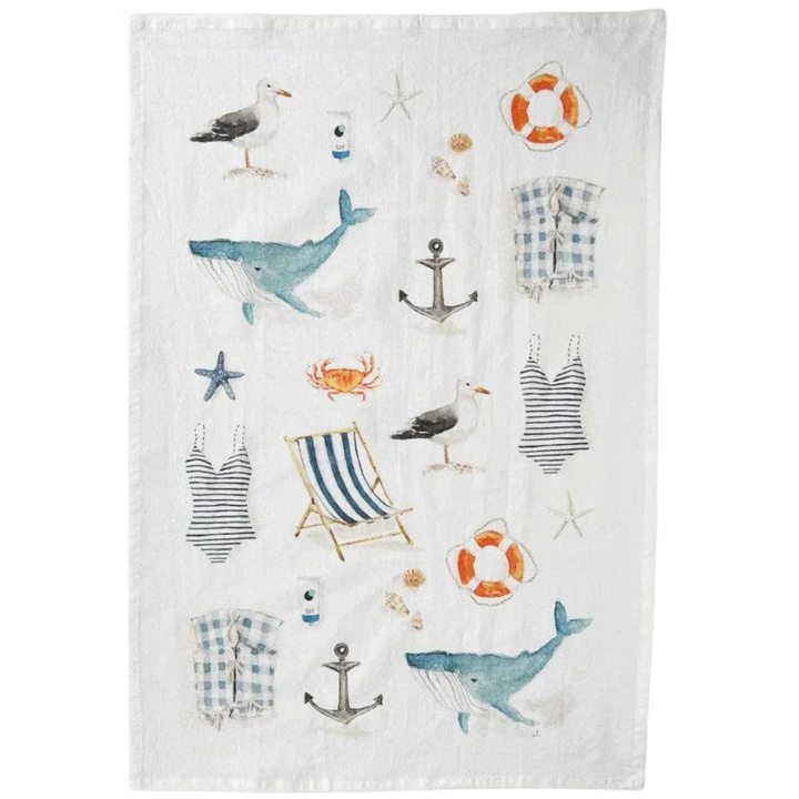 Decorative towel with nautical-themed watercolor illustrations including whales, anchors, and life buoys 