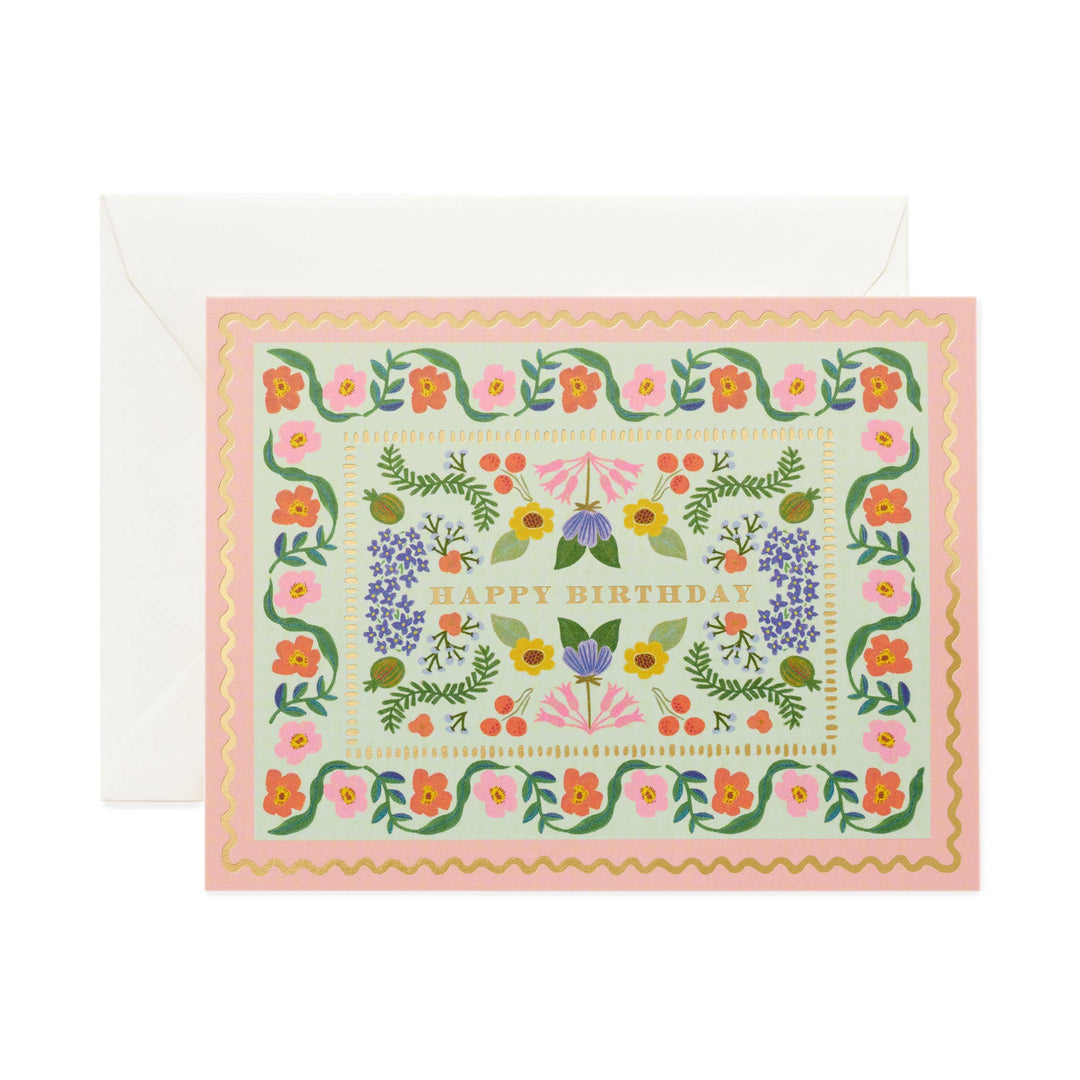 birthday card with floral design and 'Happy Birthday' text 