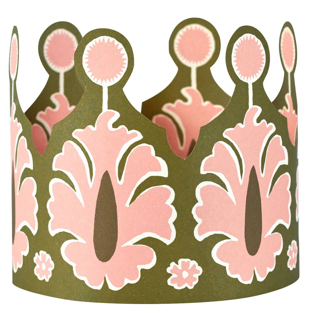 Decorative green paper crown with pink floral patterns 