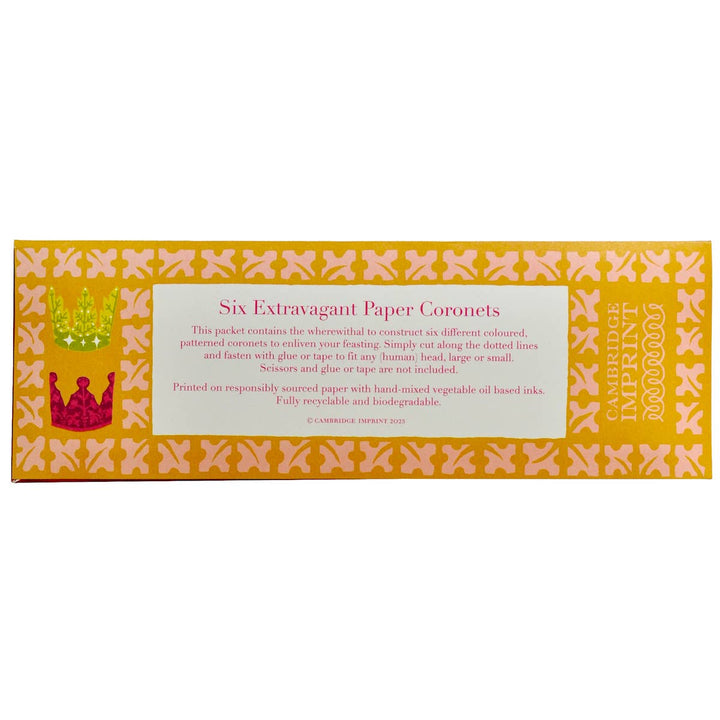 Packaging of six extravagant paper coronets with decorative design and text