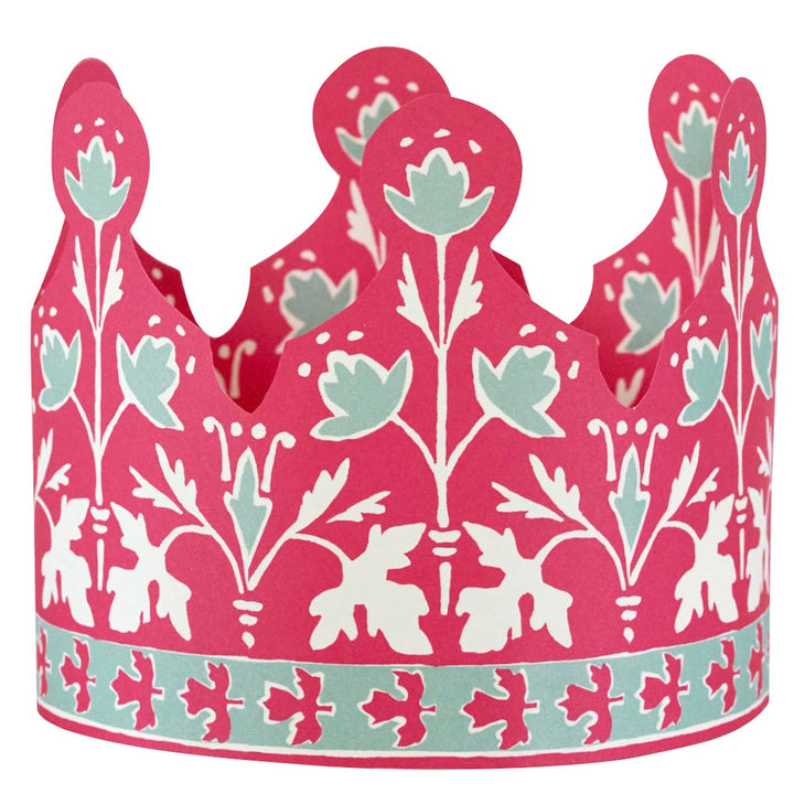 Decorative paper crown with pink, white, and blue floral pattern 