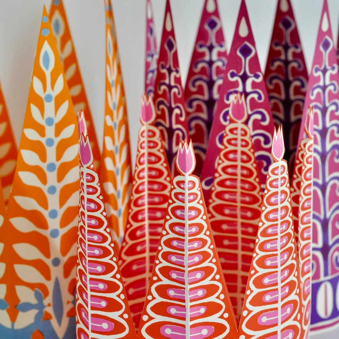 colorful red, blue, and pink party crowns