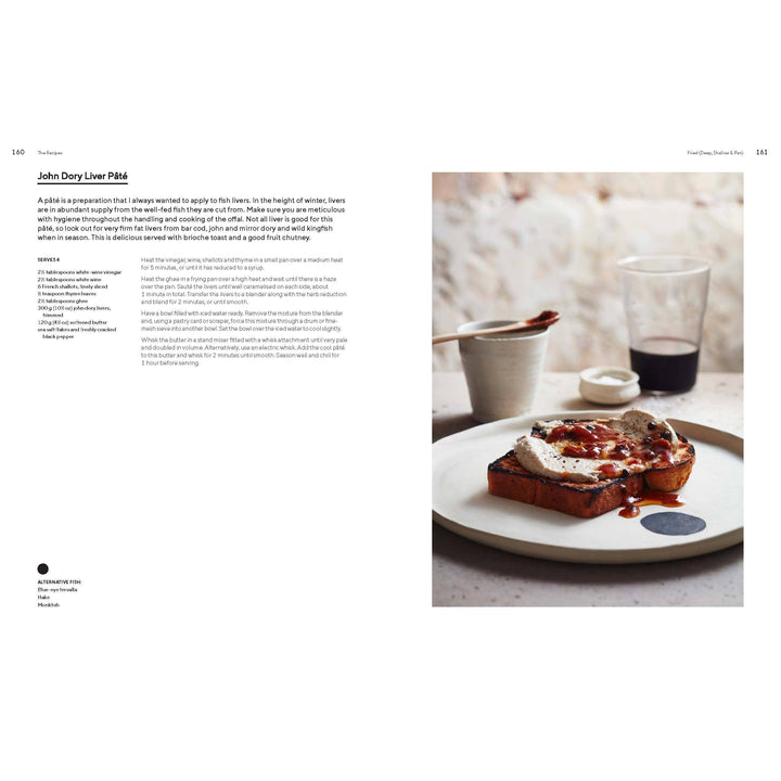 Plate of food with a cup on a table, featuring a blurred background