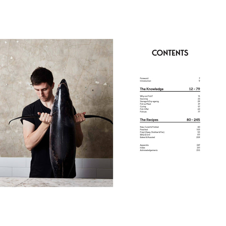 Man holding a large fish with a table of contents on the right side.