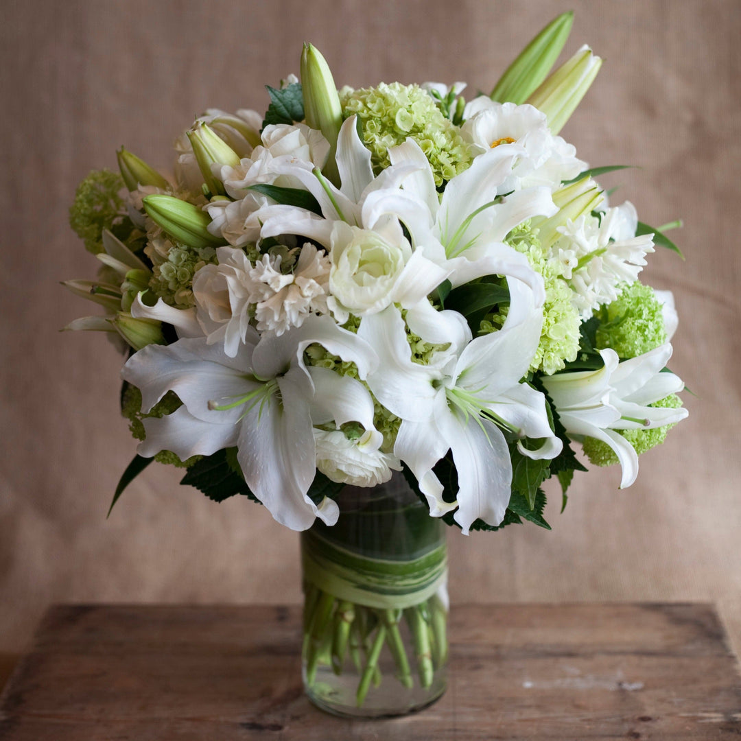 sympathy arrangement white lilies hydrangeas roses 