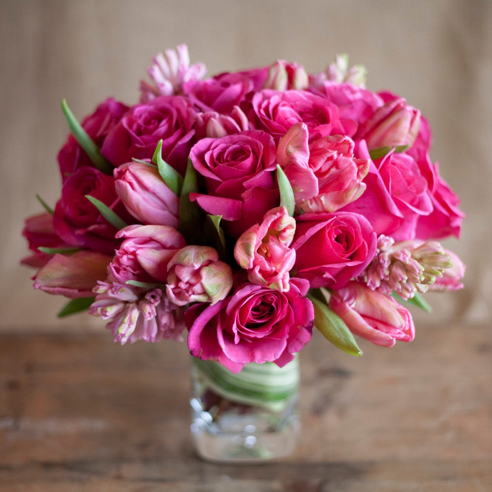 bouquet arrangement vase pink roses  pink tulips 