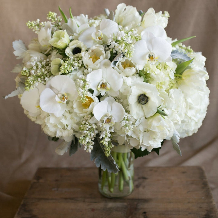 sympathy floral arrangement bouquet white anemone orchid ranunculus 